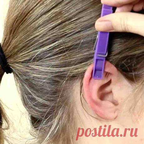 Прищепка в ухе