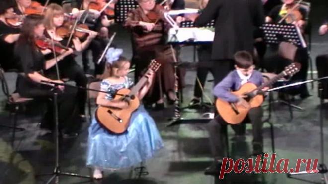 2015г.Казань-филармония.Симфонический оркестр "Романтика".Солисты:Виктория Никишина-9 лет,Владислав Шарафутдинов-10 лет.