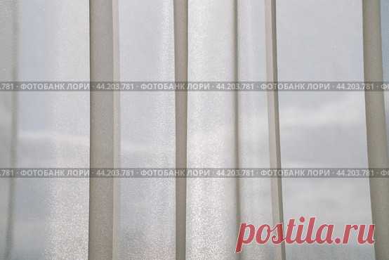 Window with light tulle curtains, sky clouds background Стоковое фото, фотограф Ilaronsia / Фотобанк Лори