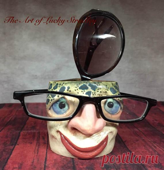 EYEGLASS CADDY - to hold your pens, spare change, rings and things for you. Keep in the bathroom and he can hold your toothbrush. EC22 This is Caicey. He was born February 23, 2017. A lovely home decor accent piece that is just the right size to sit on your shelf, counter top, mantle, bedside table or bathroom vanity. This cute little eyeglass caddy can hold your tooth brush or just empty your pockets of your spare change into the vessel interior. The hook on the back is a...