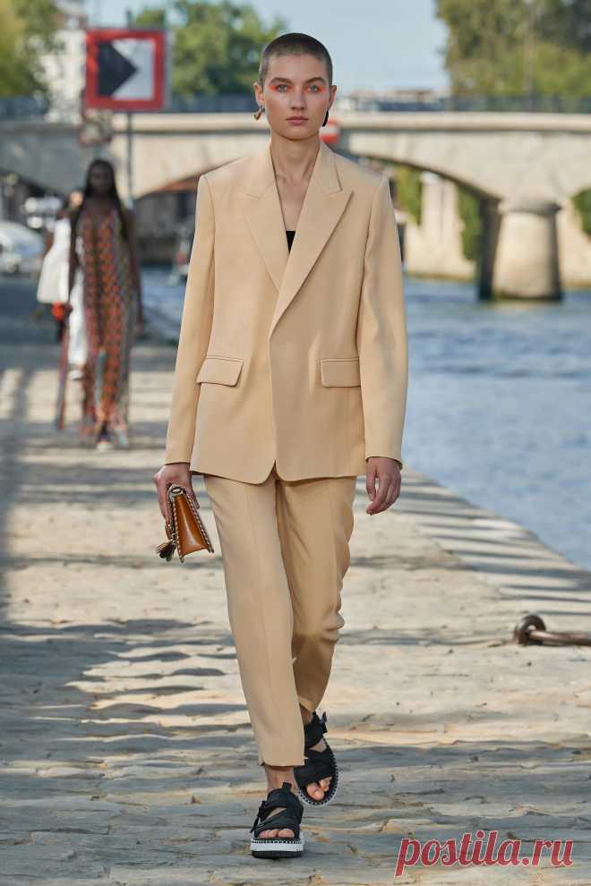 Image may contain Clothing Apparel Suit Coat Overcoat Human Person Jacket Blazer Footwear Shoe and Khaki