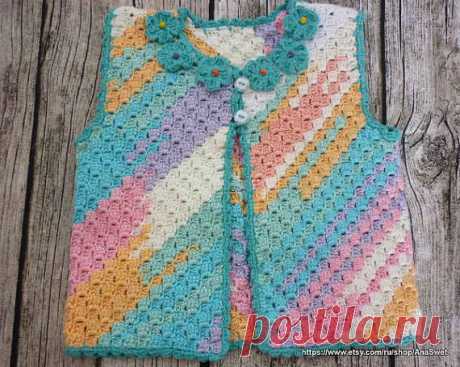 Crochet baby cardigan.Baby Girl Crocheted Sleeveless Vest. This handmade, sweet, baby crochet sleeveless vest is very practical.100% Acrulyc. Size: length - 28 cm/11  width -25cm/10  The design is the work of AnaSwet .You receive the cardigan in handmade packaging and beautiful card.  Machine washable 30 All items are unique in design and handmade in a nonsmoking environment. All used materials have been carefully selected with regard to quality and appropriateness for bab...