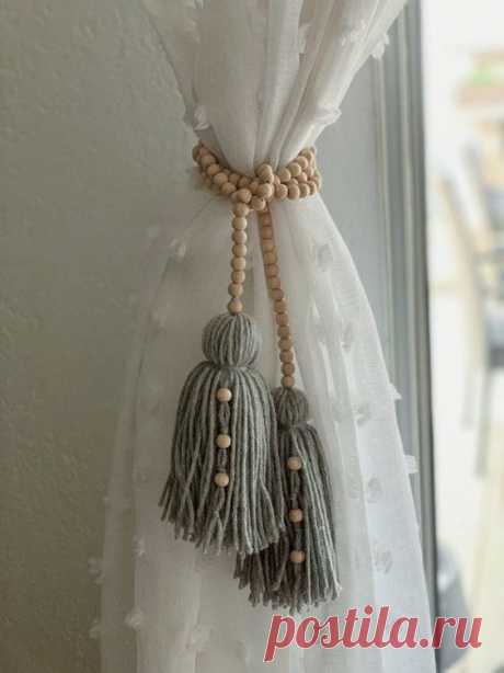 This wood bead garland has two tassels on each end. You can wrap around the garland to your area of choice! I love how unique this is and how simple it is to accent your draping and curtains as we did…