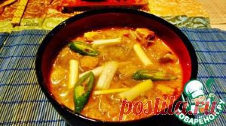 Острый суп из кимчхи со свининой.