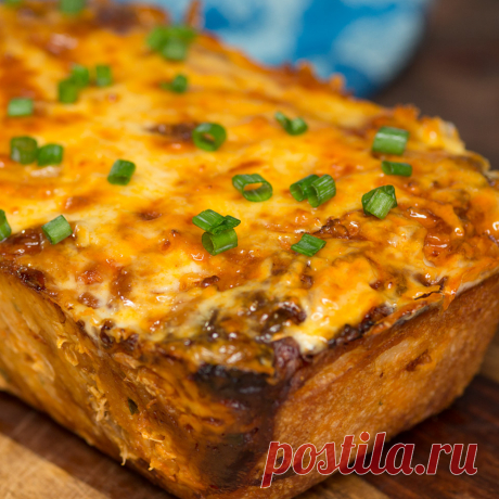 Buffalo Chicken Pull-Apart Bread ~ Recipe Recipe with video instructions: The only way to improve shareable bread is with Buffalo chicken and lots of cheese. Ingredients: 2 packages Pillsbury pizza dough, 2 cups chicken, cooked and shredded or diced, 1 cup Buffalo sauce, ¼ cup scallions, chopped, 2 ½ cups shredded pepper jack cheese, ½ cup unsalted butter, melted, 1 jalapeño, sliced (optional), Ranch dressing for dipping (optional)