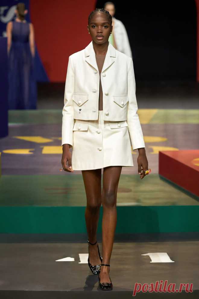 Image may contain Clothing Apparel Coat Human Person Runway and Fashion