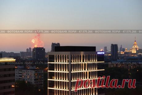 High angle view of illuminated buildings against sky with fireworks (2013 год) Редакционное фото, фотограф Ilaronsia / Фотобанк Лори