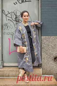 The Kuwaiti fashion blogger is wearing a modern take on the bisht. 