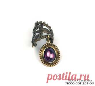 Кафф "Викторианская эпоха"
Изящный филигранный акцент в духе викторианской эпохи. Серёжка кафф с подвеской фиолетового фианита.