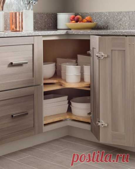 04 baking dishes stacked in a corner storage space - Shelterness