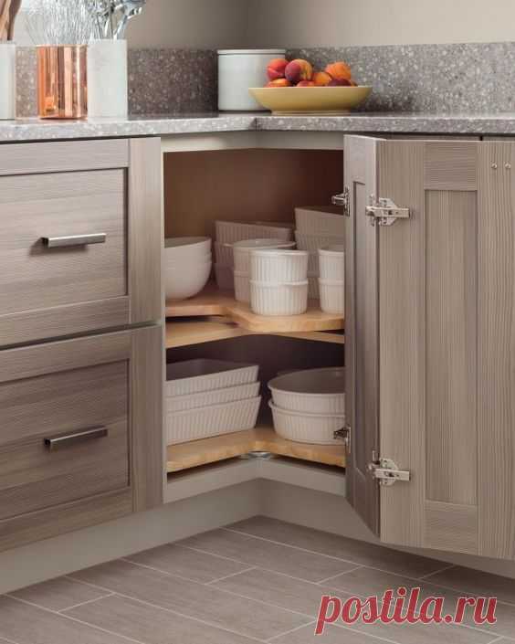 04 baking dishes stacked in a corner storage space - Shelterness