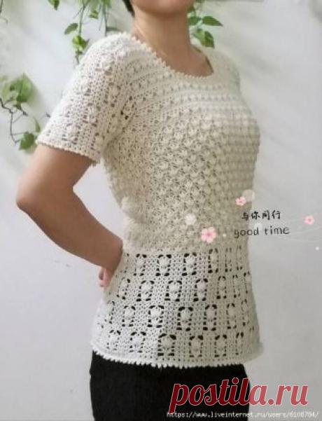 Белая ажурная кофточка, выполненная миксом узоров.