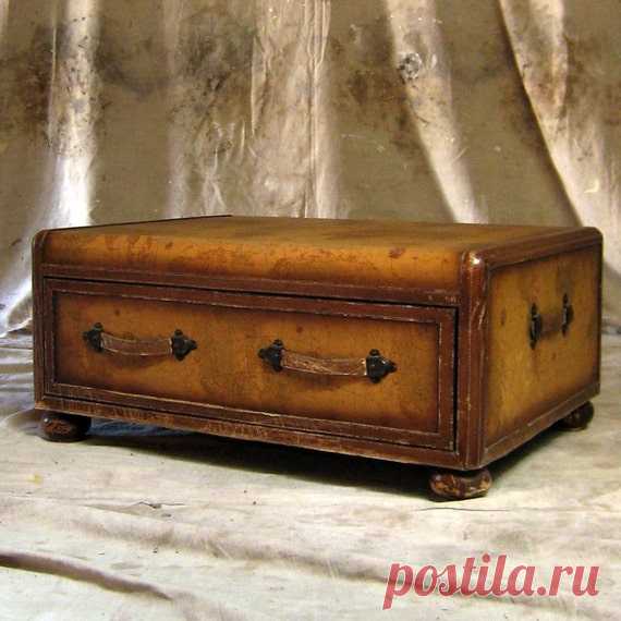 Around the World  Vintage World Map Coffee Table | Etsy Aged with rough-edged beauty    Tawny Toned World Map Covers this aged wood frame trunk.  World-weary brown leather trims the piece. The front drawer opens for storage.    The leather handles, trim and wood feet are aged. If you would like additional photos, please contact us.  Please note the