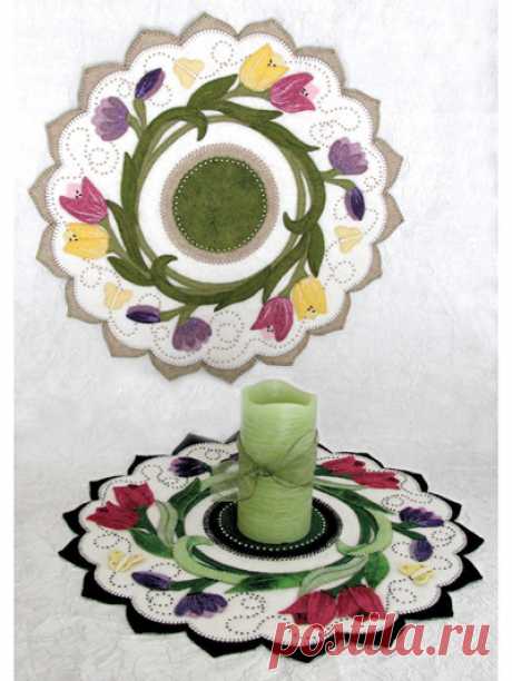 Tulip Swirl Table Topper Pattern Take a breath of fresh air and stitch up this lovely spring swirl of tulips and crocuses along with 3-D butterflies. This is a 17" circular topper designed in wool felt or felted woven wool. Two colorways are included in the pattern.