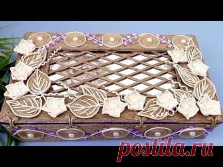 Organizer for glasses, made of cardboard and jute yarn.