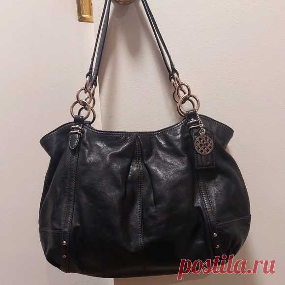 COACH Alexandra Black Leather Tote Shoulder Bag Shop momof4kiddos2's closet or find the perfect look from millions of stylists. Fast shipping and buyer protection. Beautiful black leather Coach bag!
2010 #16244
Silver chain and leather straps
Pleated details 
Roomy interior features 3 separate compartments. Middle compartment zips closed. Other compartments contain 1 zip and 2 slip pockets.
Blue satin lining
Snap closure at top of bag.
Leather and signature C metal hangtag...