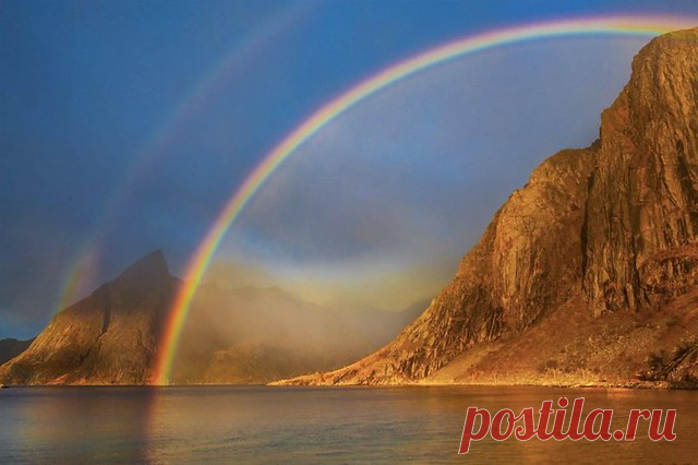 Rainbow's End Lofoten, Norway  You may recognize this mountain if you have seen photo's taken from the bridge at Hamnoy.  I was fortunate to stay in a house at the water's edge here and was treated to a spectacular sunrise on my last morning there.  These scenes happen so quickly, don't they?