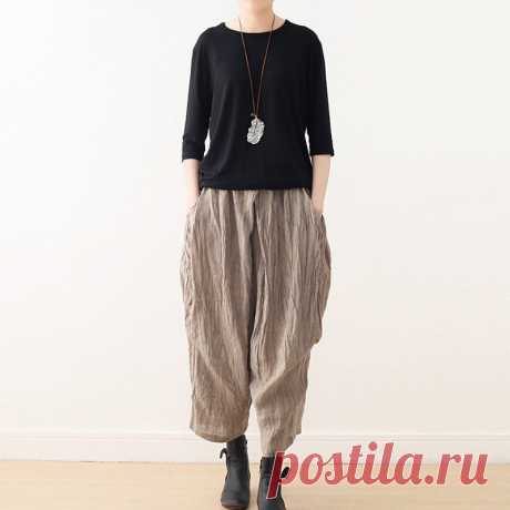 Casual Linen Wide-Leg Pants with Pleated Texture for Women Shop our Women's Summer Retro Loose Pleated Linen Wide-Leg Pants for a stylish and comfortable addition to your wardrobe, available in khaki, gray, and black.