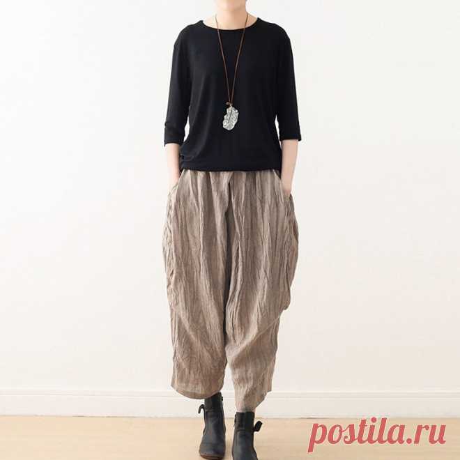 Casual Linen Wide-Leg Pants with Pleated Texture for Women Shop our Women's Summer Retro Loose Pleated Linen Wide-Leg Pants for a stylish and comfortable addition to your wardrobe, available in khaki, gray, and black.