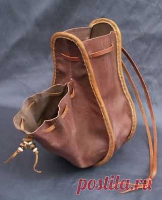 (189) Made from vegtanned calf & goat skins that have been dyed using period dyes and they are made entirely by hand. This design is based on a figure in…