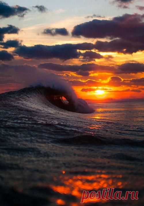 Waves crashing at sunset