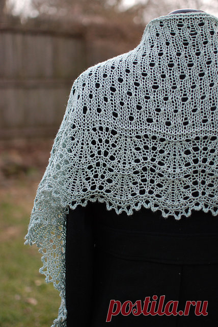 «This crescent shaped lace shawl begins at the bottom edge with a picot cast on, followed by a lovely border of gently curved lace, which gives the shawl a pretty scalloped bottom edge. The body of the shawl is an array of eyelets that are worked in short rows to create the crescent shape.» — карточка пользователя Veneta L. в Яндекс.Коллекциях