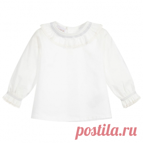 Baby Girls Ivory Cotton Blouse Ivory blouse for baby girls by Paz Rodriguez, made in lightweight cotton. The pretty ruffle collar and cuffs are trimmed in delicate lace.

