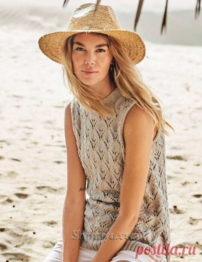 Плотно прилегающая к шее бейка горловины, глубокие проймы, открывающие плечи, и высокие разрезы снизу - изысканная форма этого топа уже сама по себе заслуживает внимания. Добавьте ажурный ромбовидный узор, мягкую пряжу из хлопка с вискозой -и лучшего спутника для отдыха на море вам не найти!