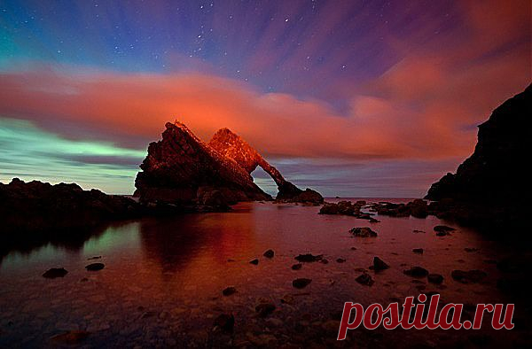 Bow Fiddle Rock aurorascape. Portknockie, Scotland. Photo by Kenny Muir Photography.