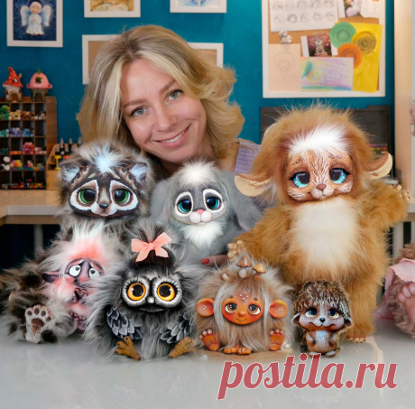 This may contain: a woman is posing with her collection of stuffed animals and dolls in front of the camera