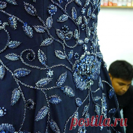 Embroidery master, Mustaq, is inspecting the 7 meters #hem #sweep of a #fully #beaded  #midnight #blue #silk #dupion #gown worthy of a #redcarpet ... | #handembroidery #tambour #beading #handmade #embellished #fashion and #bridal #artisanal #craftsmanship #heirloom #style #ethicallymade