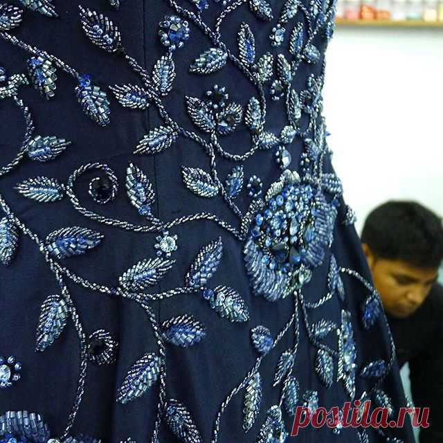 Embroidery master, Mustaq, is inspecting the 7 meters #hem #sweep of a #fully #beaded  #midnight #blue #silk #dupion #gown worthy of a #redcarpet ... | #handembroidery #tambour #beading #handmade #embellished #fashion and #bridal #artisanal #craftsmanship #heirloom #style #ethicallymade