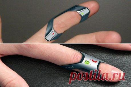 Nokia FIT – это концепция телефона, которую можно носить на пальце. Выполненная из мягкого силикона и гибкой резины, телефон полностью водонепроницаемый и поддерживает голосовое общение и смс. Вы можете взять его с собой в бассейн и наслаждаться весельем даже если вы ждете важного звонка.