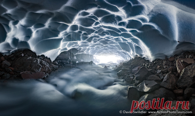 Rushing Enclosure During our visit to Mt Rainier last weekend, we found this snow cave carved out by the rushing flow. Going inside a snow cave can be dangerous and you should have the proper safety equipment. But it is such a surreal experience with the fluted ceiling textures, the drips of water coursing down, and the sound of the rushing stream echoing off the walls.  While snow caves are cool (pun intended), ice caves take the experience to a whole different level! Ima...