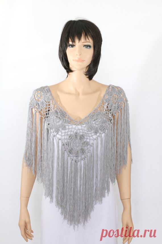 Gray Cape Bridal Shawl Crocheted Shawl Wedding Wrap Bridal Accessories Wedding Shawls Handmade shawl When it comes to accessorizing, boring necklaces are a thing of the past! This delicate handmade poncho is a modern styling option that will set the tone for a stunning ensemble. Designed in artistic detail, it is handmade from fine quality acrylic/cotton yarn blend and features a flower pattern with extra-large fringe accents cascading beneath. You’ll want to pair it will ...
