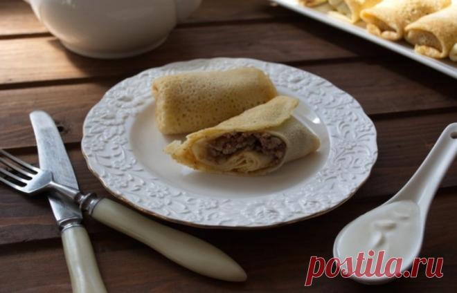 Блины, фаршированные мясом Блины - национальное русское блюдо, интерпретаций которого существует множество. В данном рецепте представленные блинчики фаршированные мясом, пригото