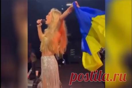 Двойное дно. Брежневу осудили за песни на русском с украинским флагом. Вера Брежнева поет на русском языке, размахивая при этом украинским флагом. Что это?