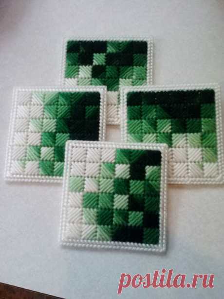Plastic Canvas Coasters These are mixed greens and white with a white boarder. They measure 4 X 4 with a plastic backing.