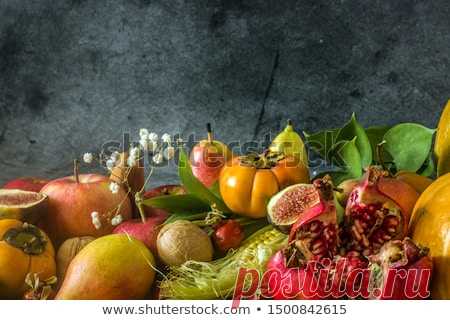 Still life of vegetables and fruits on a dark background. Autumn harvest of fall fruits. Apples, pears, pumpkin, persimmon, nuts, corn, figs. Save spaceAutumn nature concept. Thanksgiving dinner  Discover this and millions of other royalty-free stock photos, illustrations, and vectors in the Shutterstock collection. Thousands of new, high-quality images added every day.
