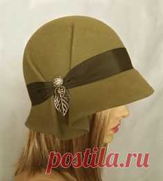 This beautiful ladies cloche is made from fur felt, and hand draped over an antique hat block. Hand finished with authentic millinery techniques, and embellished with grosgrain ribbon, and vintage buttons and toggles (these will vary depending on supply). Please indicate your head size measurement
