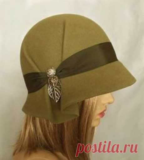 This beautiful ladies cloche is made from fur felt, and hand draped over an antique hat block. Hand finished with authentic millinery techniques, and embellished with grosgrain ribbon, and vintage buttons and toggles (these will vary depending on supply). Please indicate your head size measurement