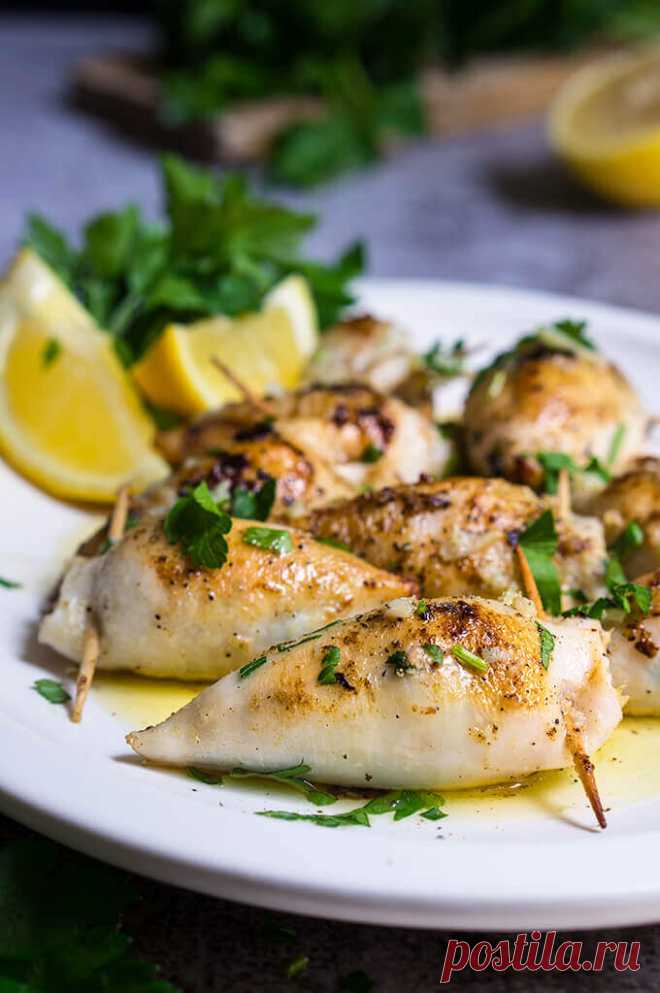 Stuffed calamari in lemon butter sauce - Viktoria's Table Stuffed calamari in lemon butter sauce - these delicious calamari bites are stuffed with creamy tuna filling, then cooked in a luscious tangy lemon butter sauce, with capers, garlic and lots of fresh parsley.