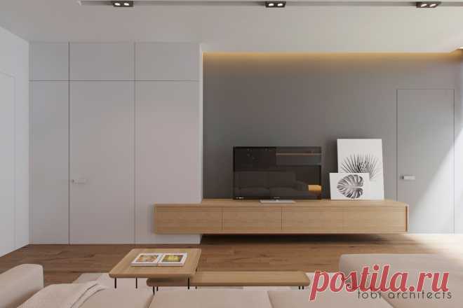 Было предложено создать лаконичный дизайн интерьера —  LOOKING AT DNIPRO, для  апартаментов, с прекрасным видом на реку Днепр.
Благодаря панорамным окнам – комнаты наполнены светом и теплом.
Прихожую ми предложили отделить перегородкой из деревянных реек. Данное решение позволило использовать как функционального элемента и декорации.
Еще одна особенность интерьера — кухня, которая «оторвана» от пола. Это решение позволило добавить легкости и воздушности дизайну.