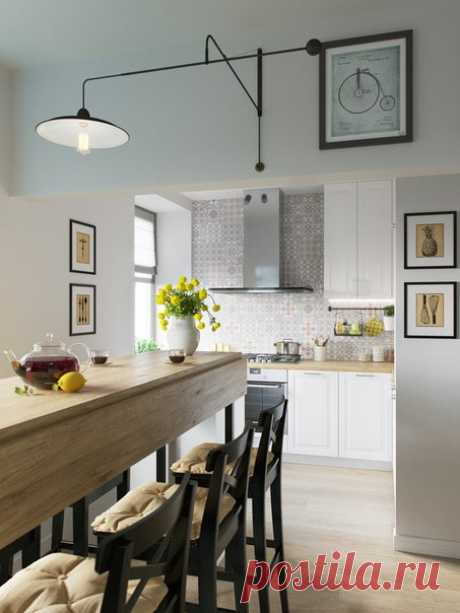 Дизайнер Никита Зуб говорит, что главной проблемой в этом проекте был ригель, отделяющий кухню от гостиной. Так как эти помещения было решено оставить совмещенными, ригель пришлось задействовать функционально, разместив на нем графику и светильник. Читать далее: