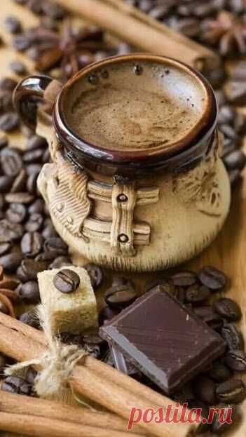 cup of coffee with spices and chocolate