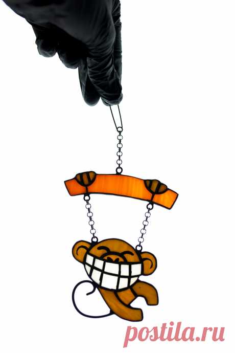 Funny monkey window hanging Stained glass suncatcher Window pendant Mo Window hanging suncatcher made of stained glass pieces by my own disign.Handmade using Tiffany copper foil technique.Looks amazing in the lights of a sun.You will get it completely ready for installation. It comes with a suction cup hanging and copper chain.It will be a great gift for friends or relatives. Width: 4 inc