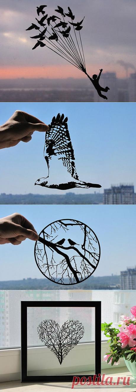 Нежные силуэты, вырезанные из бумаги.