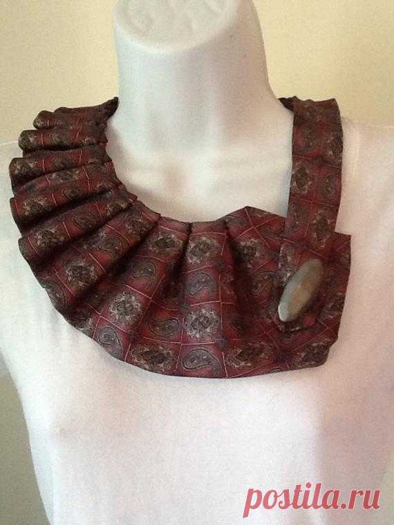 Upcycled men's necktie scarf Upcycled mens necktie scarf. Pleated with snap closure and button trim. About 21 when snapped.