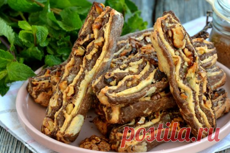 Полосатое песочное печенье с грецкими орехами - КУХНЯ МИРА Полосатое печенье приготовить несложно, для этого понадобится два вида песочного теста: светлое и тёмное шоколадное. Формируется печенье из уложенных друг на друга пластов теста с добавлением грецких орехов. В результате получается эффектное, хрустящее песочное печенье, которое понравится всем без исключения! Ингредиенты: Масло сливочное (холодное) — 120 г Сахар — 120 г Орехи грецкие (ядра) — […]