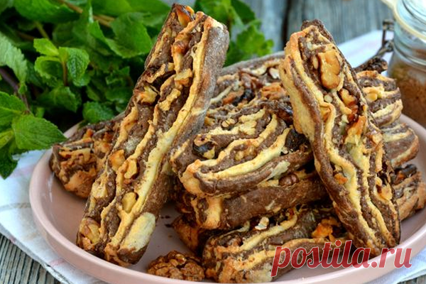 Полосатое песочное печенье с грецкими орехами - КУХНЯ МИРА Полосатое печенье приготовить несложно, для этого понадобится два вида песочного теста: светлое и тёмное шоколадное. Формируется печенье из уложенных друг на друга пластов теста с добавлением грецких орехов. В результате получается эффектное, хрустящее песочное печенье, которое понравится всем без исключения! Ингредиенты: Масло сливочное (холодное) — 120 г Сахар — 120 г Орехи грецкие (ядра) — […]